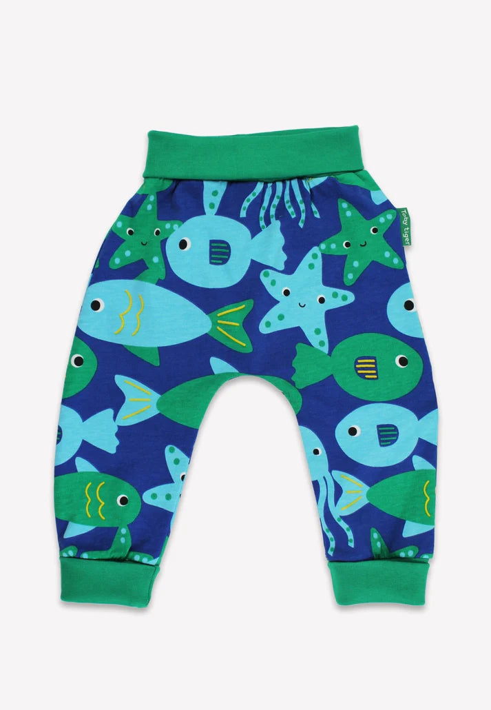 Children's pants with fish pattern on a blue background