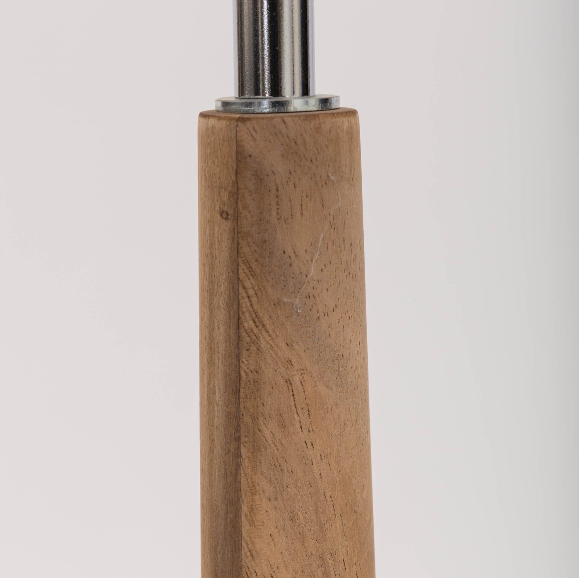 Close-up of a light brown wooden post with a metallic connector at the top.  The wood grain is visible.