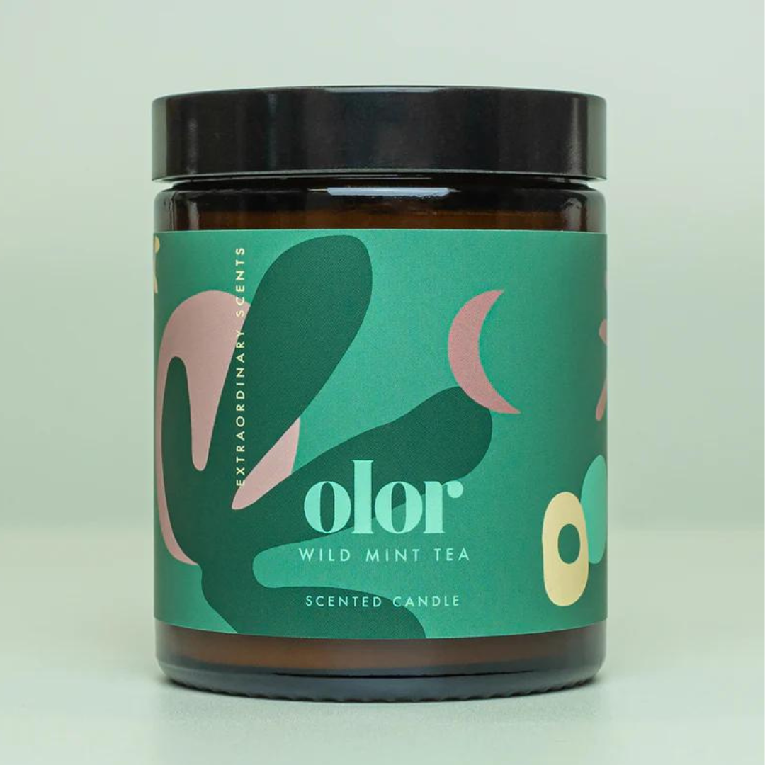 Amber jar candle with teal label;  "olor" Wild Mint Tea Scented Candle.