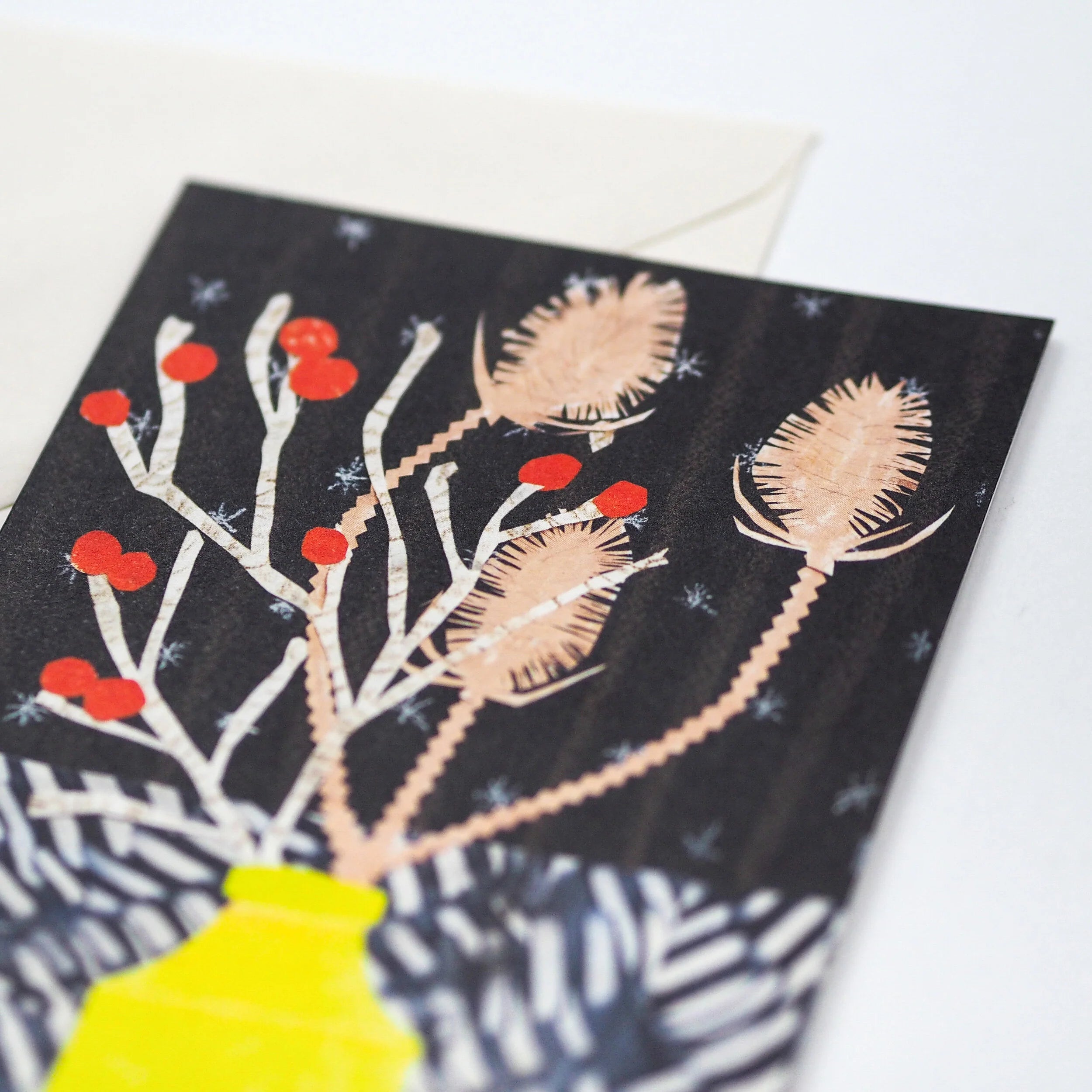 Holiday greeting card featuring a stylized illustration of winter flora in a yellow vase against a dark background.