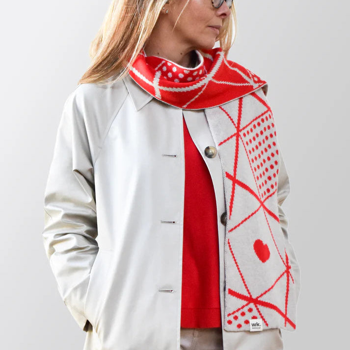 Beige and red geometric patterned wool scarf.