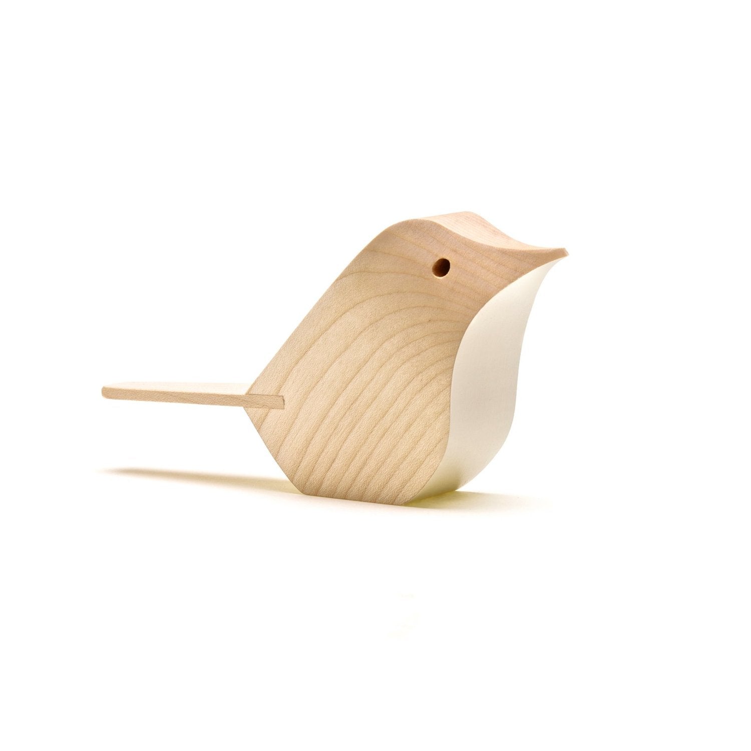 Light-colored wooden bird figurine with a simplified, abstract design.