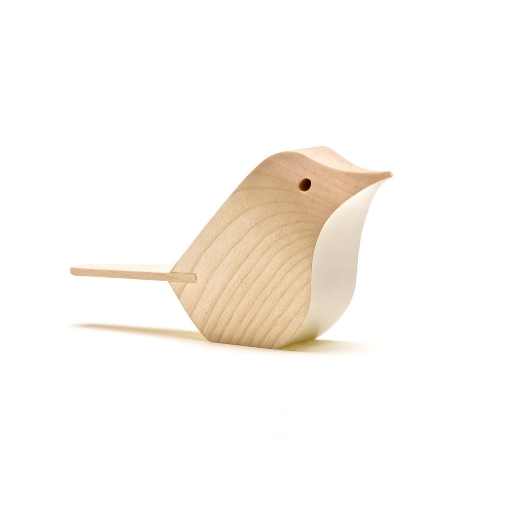 Light-colored wooden bird figurine with a simplified, abstract design.