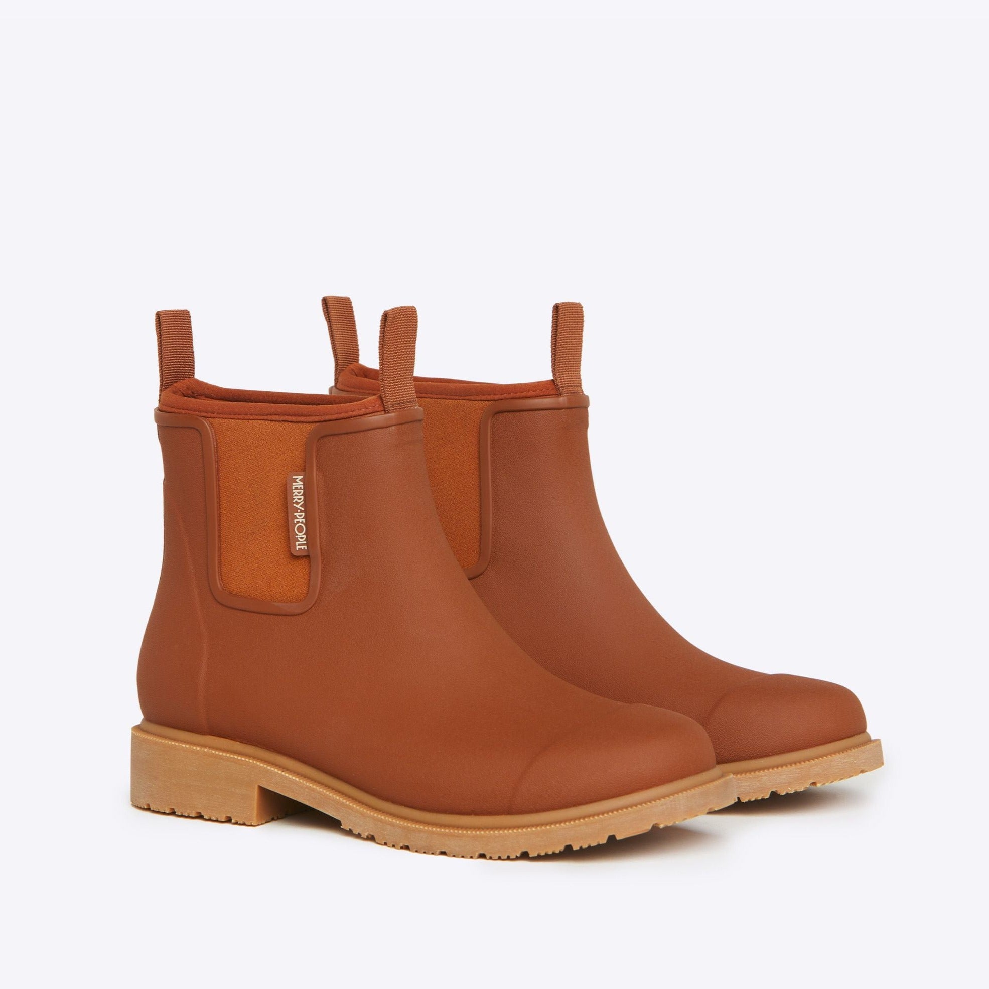 Pair of brown rubber ankle boots with a tan sole and a small logo on the side.