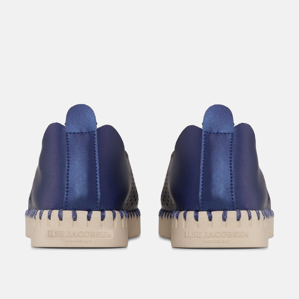 Ilse Jacobsen Hornbæk navy blue slip-on shoes with cream sole and decorative stitching.