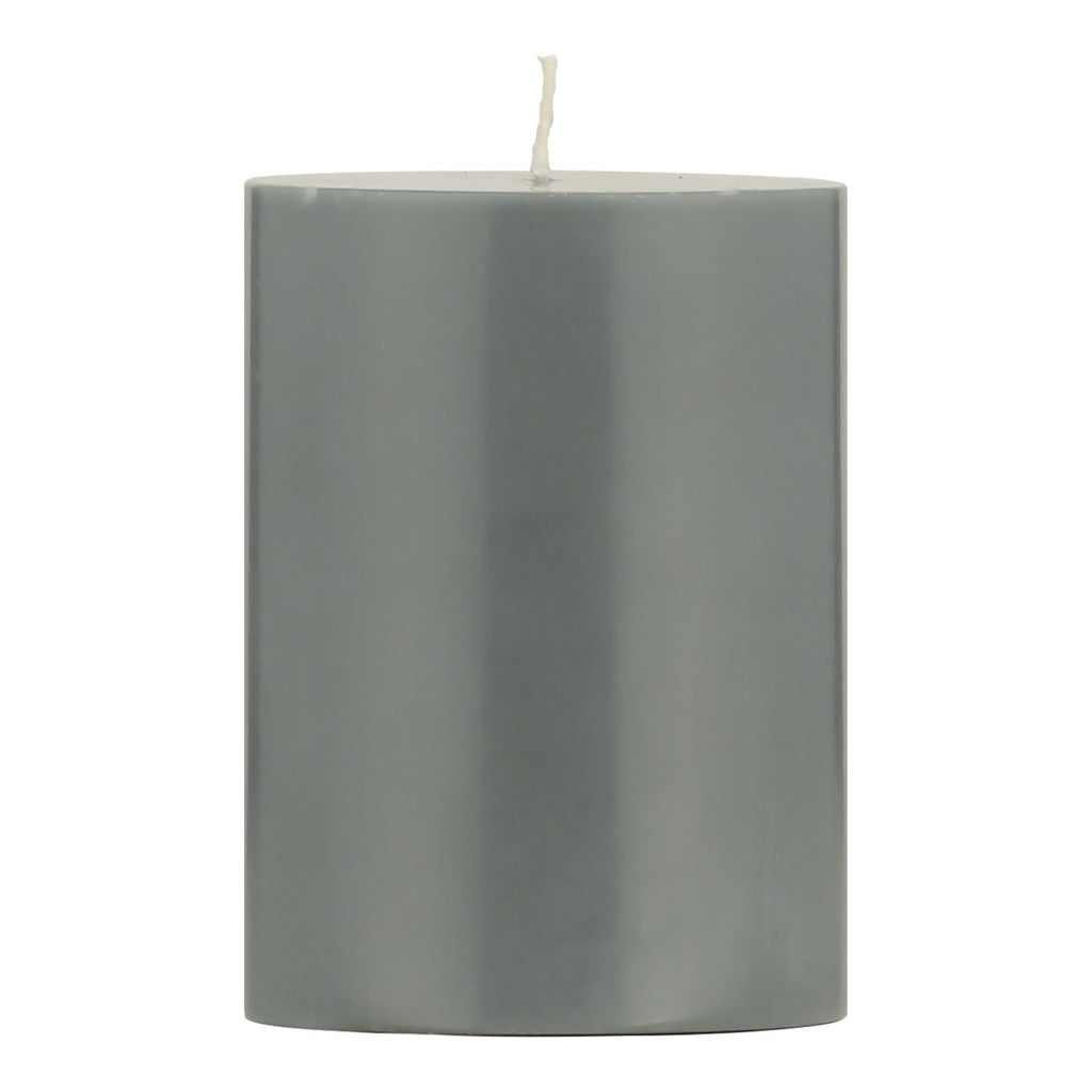 Cylindrical gray candle with a single white wick.