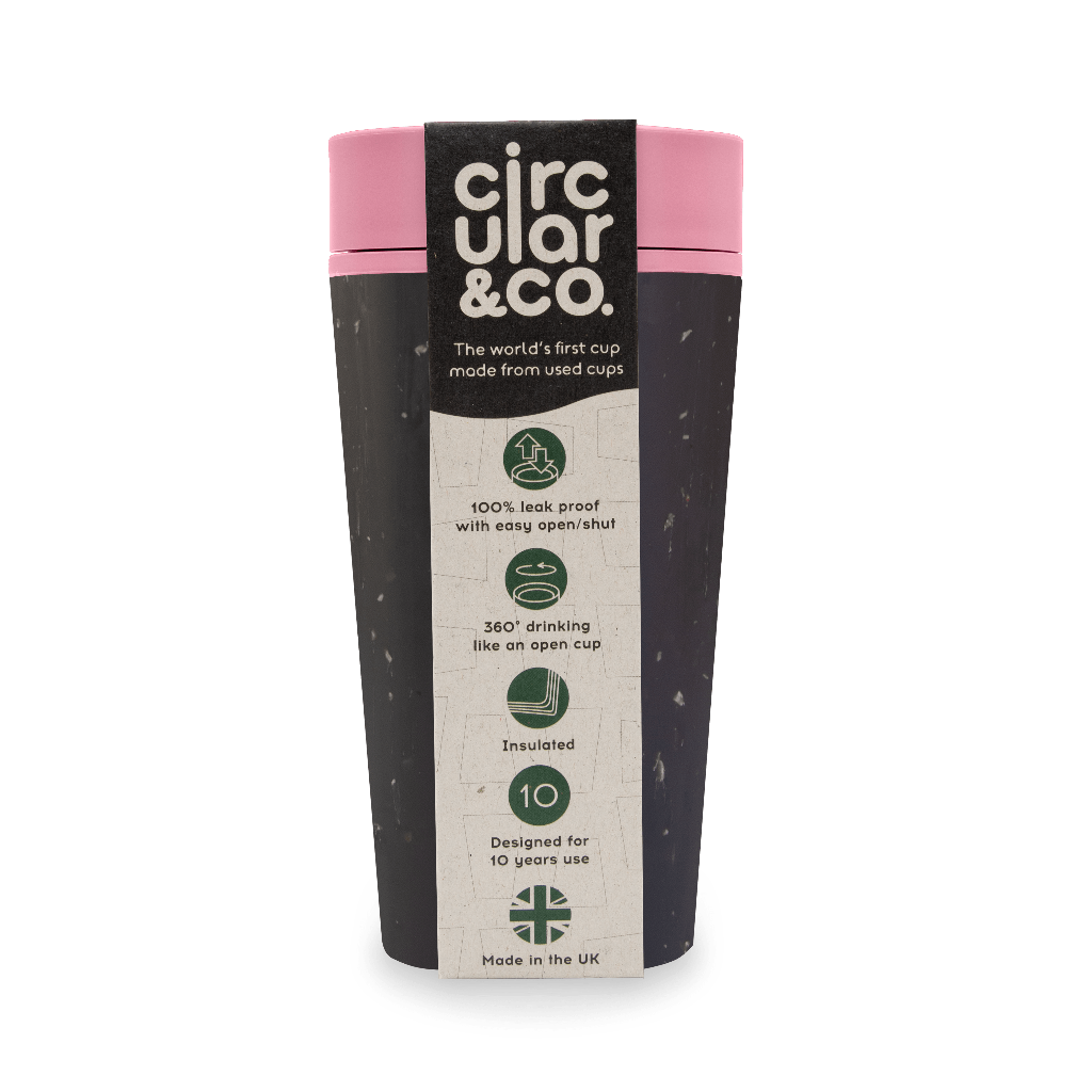 Dark gray reusable travel cup with pink lid, made from recycled cups.