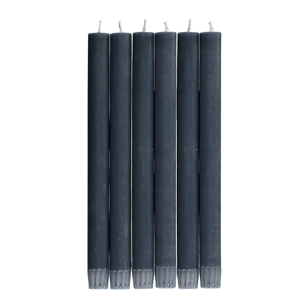 Six dark gray taper candles arranged vertically.