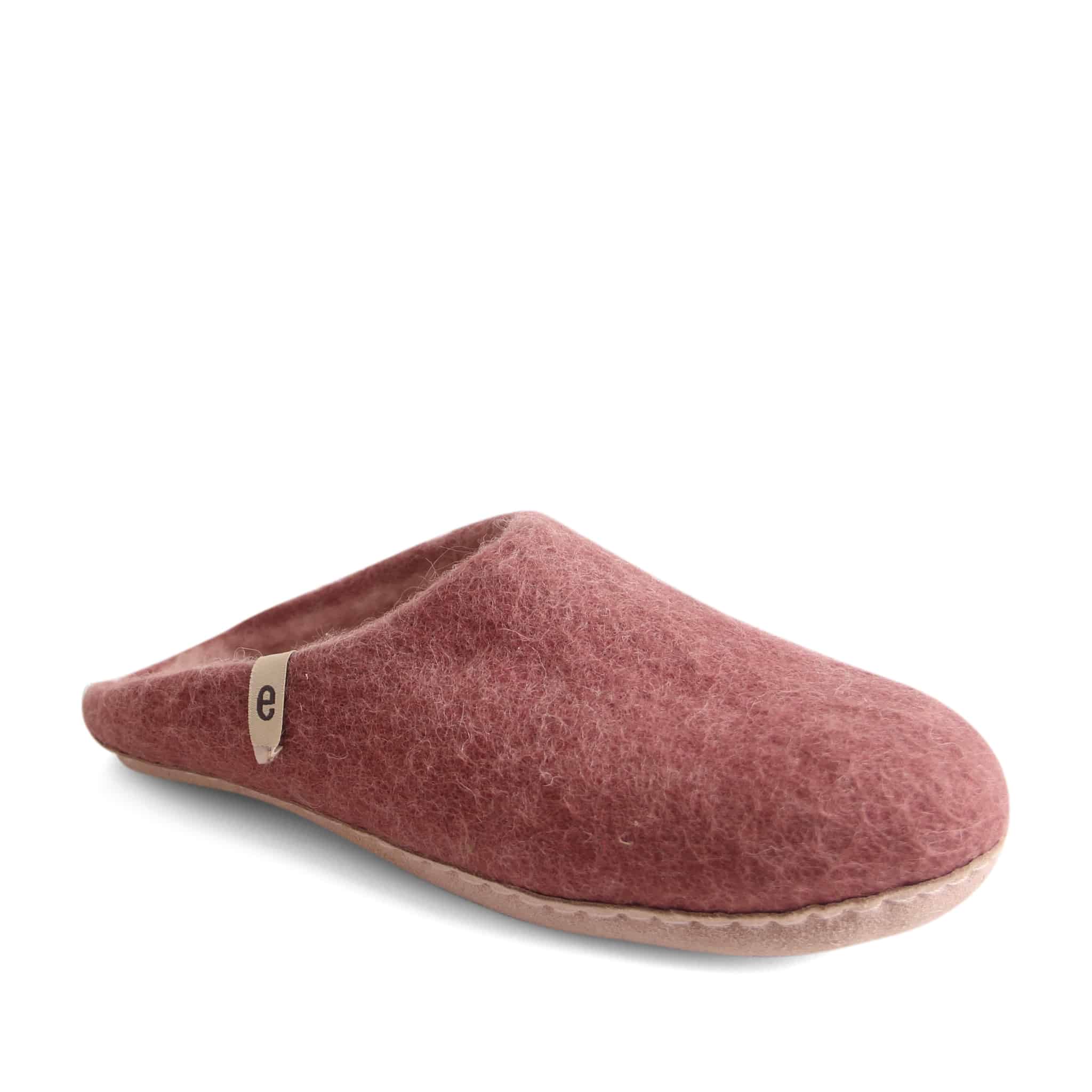 Dusty rose felted wool slipper with a light beige sole and small label.