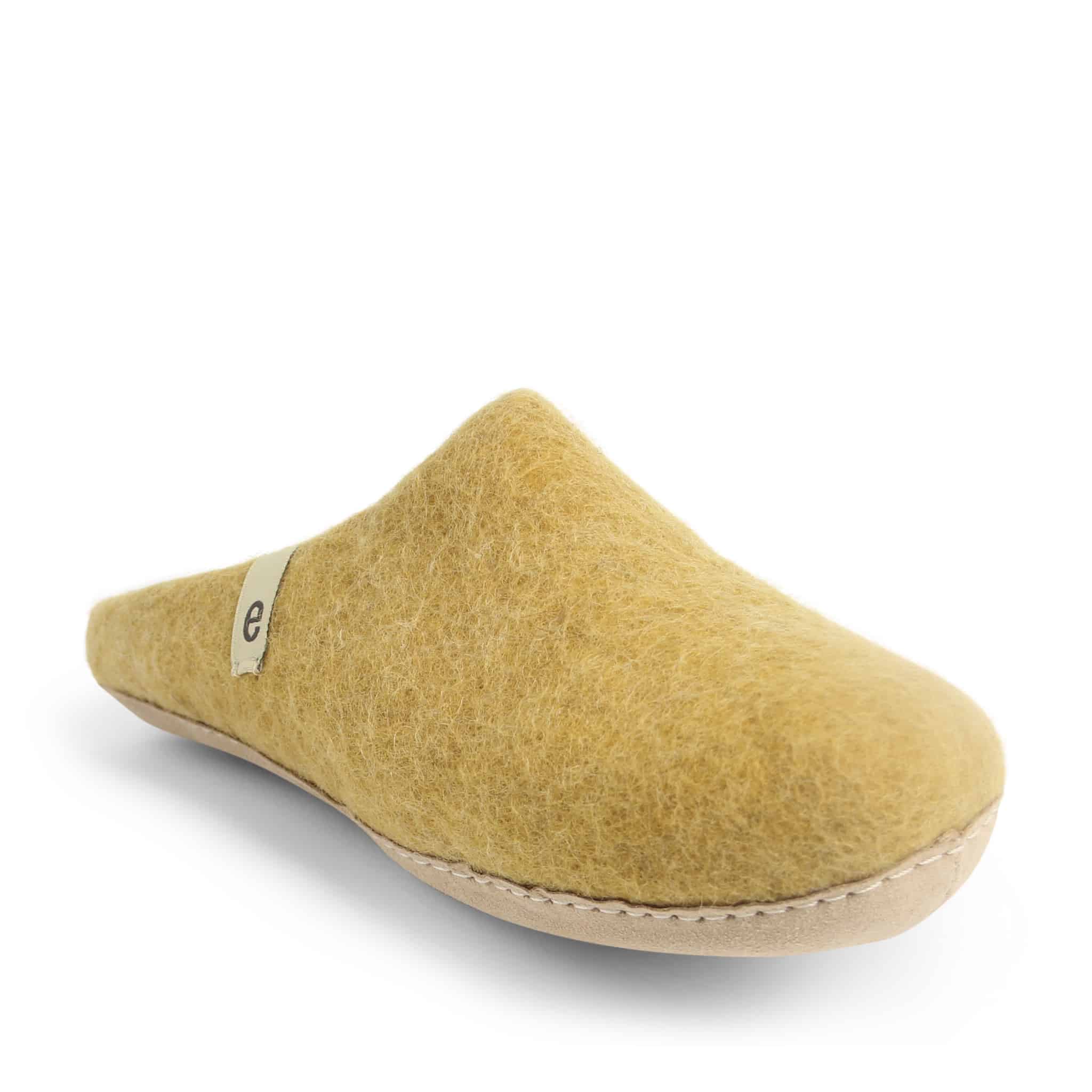 Mustard yellow felt slipper with a light beige sole and small logo.