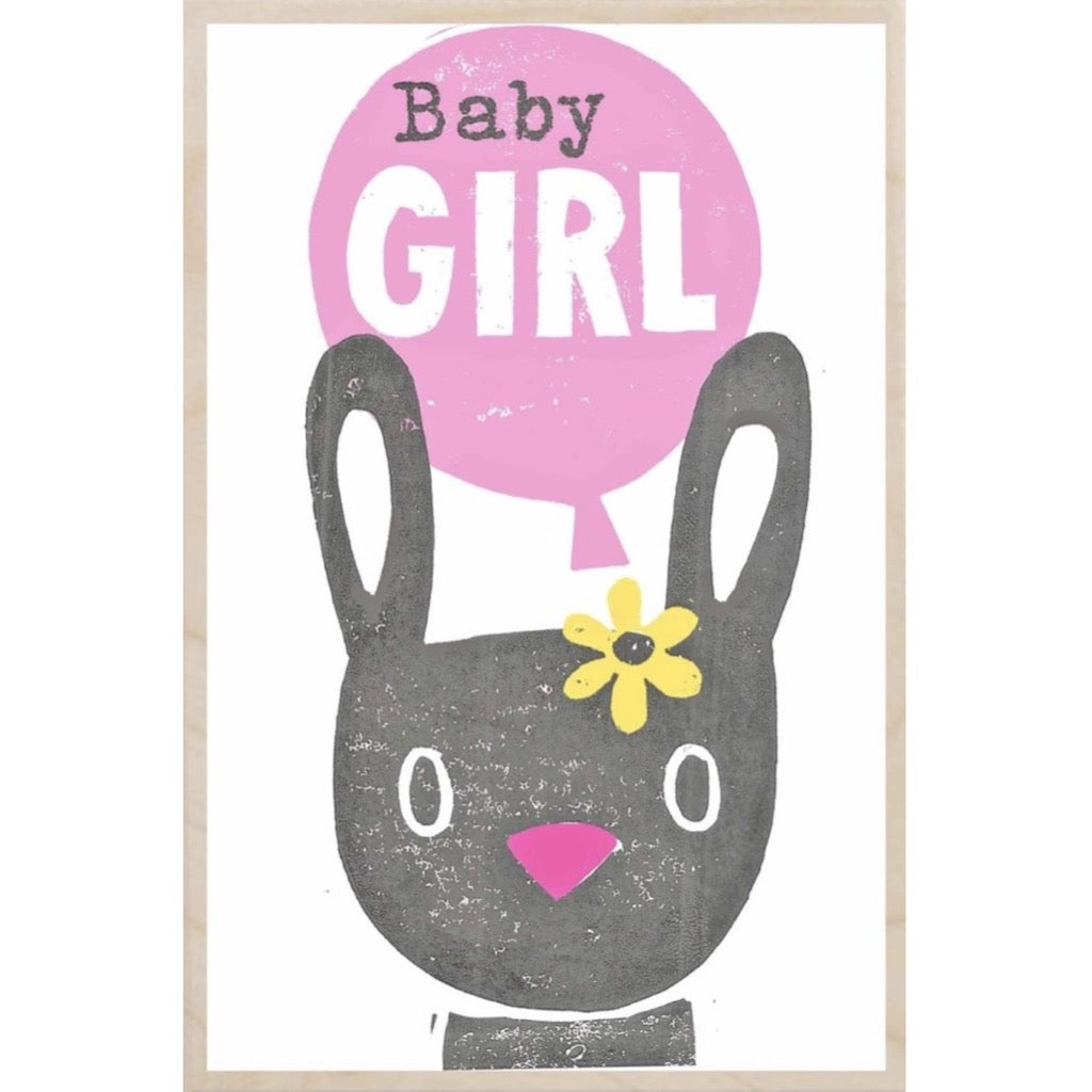 Gray bunny rabbit with pink nose and yellow flower, above which is a pink balloon that reads "Baby GIRL".