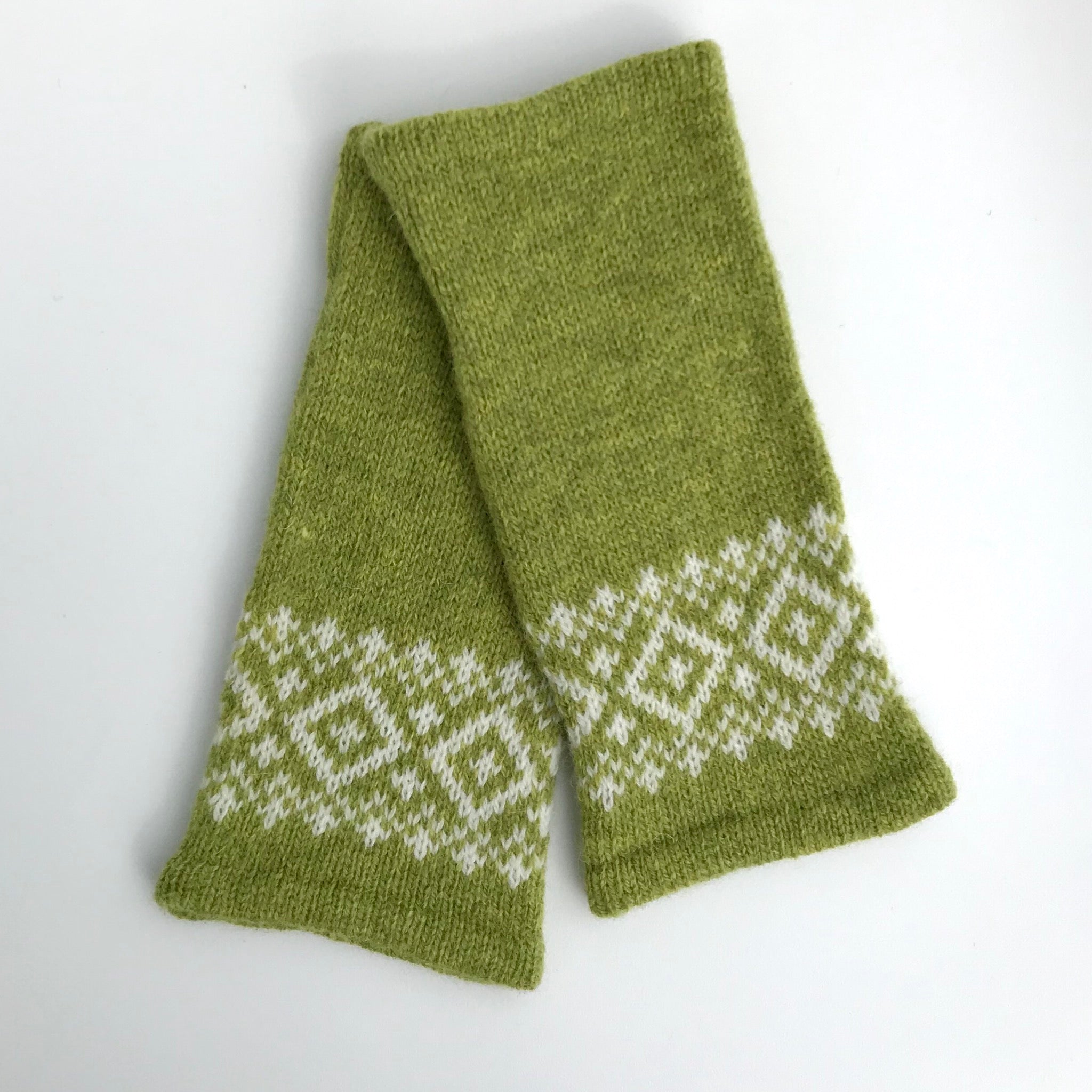 Pair of olive green knitted fingerless gloves with a white Fair Isle pattern at the cuffs.
