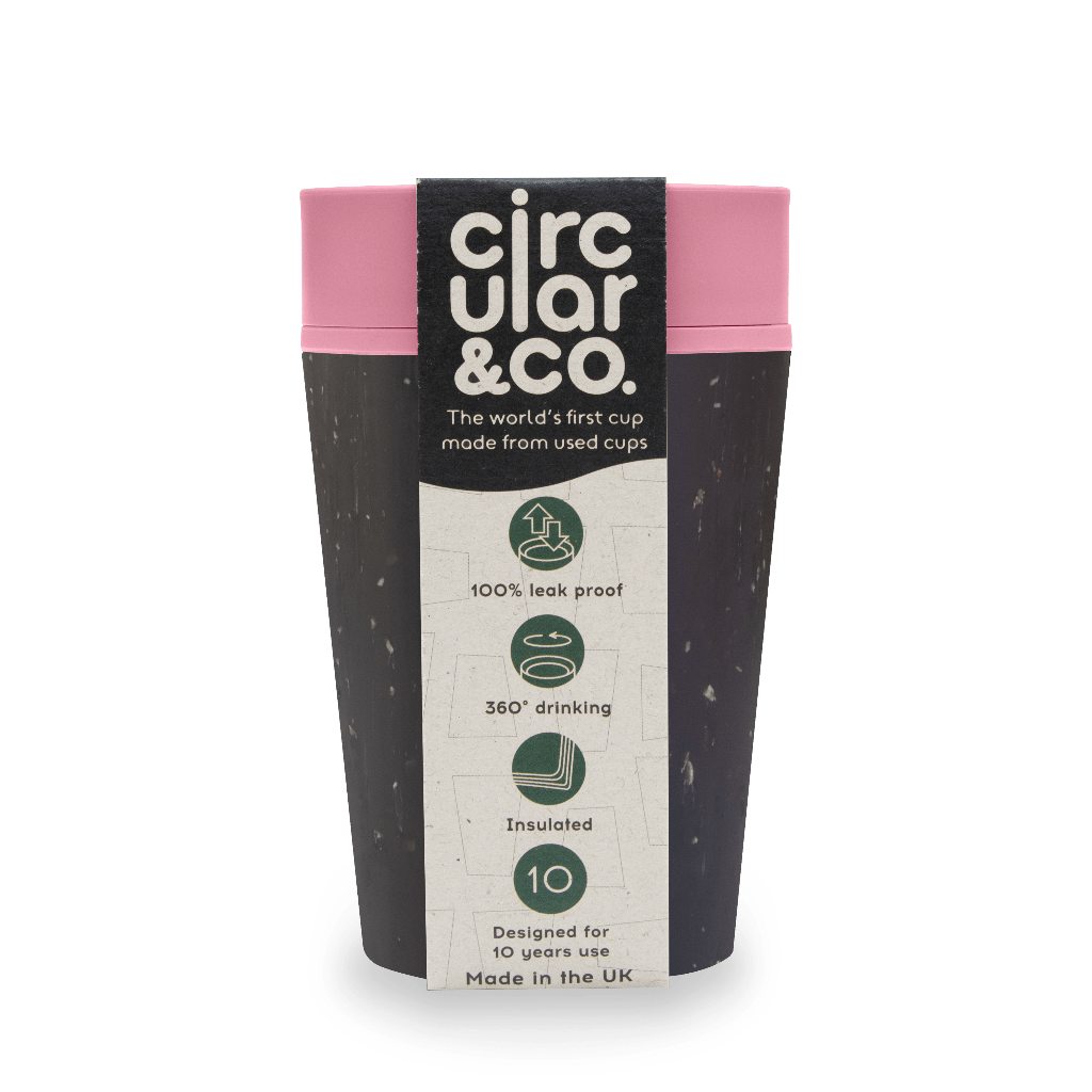 Dark gray reusable cup with pink lid, made from recycled cups.  Features 360° drinking, insulation, and leak-proof design.