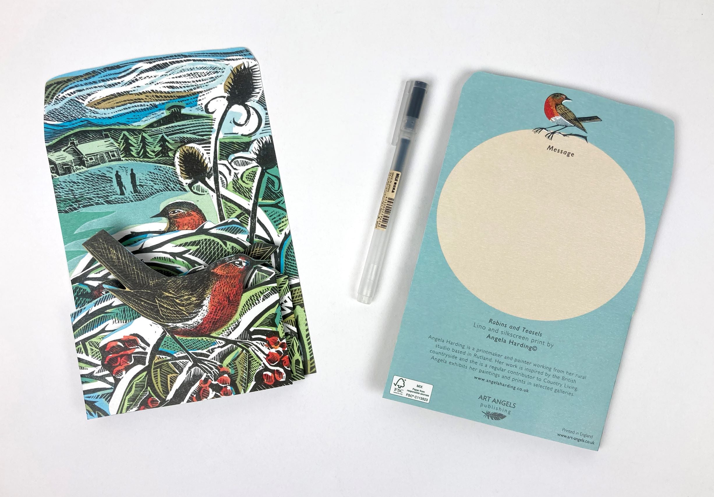 Folded notecard featuring a linocut and silkscreen print of robins and teases by Angela Harding.