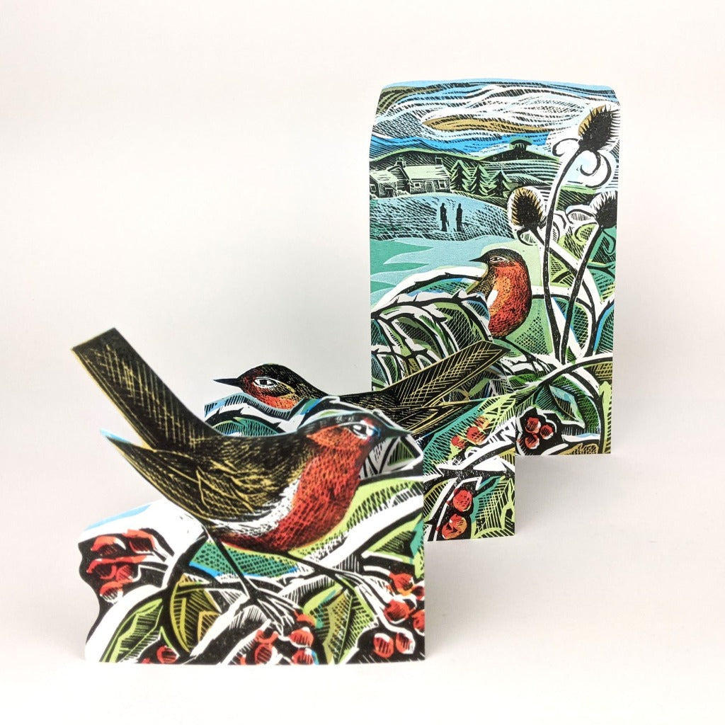 Three illustrated robins perched on branches with berries, depicted in a vibrant woodcut style.