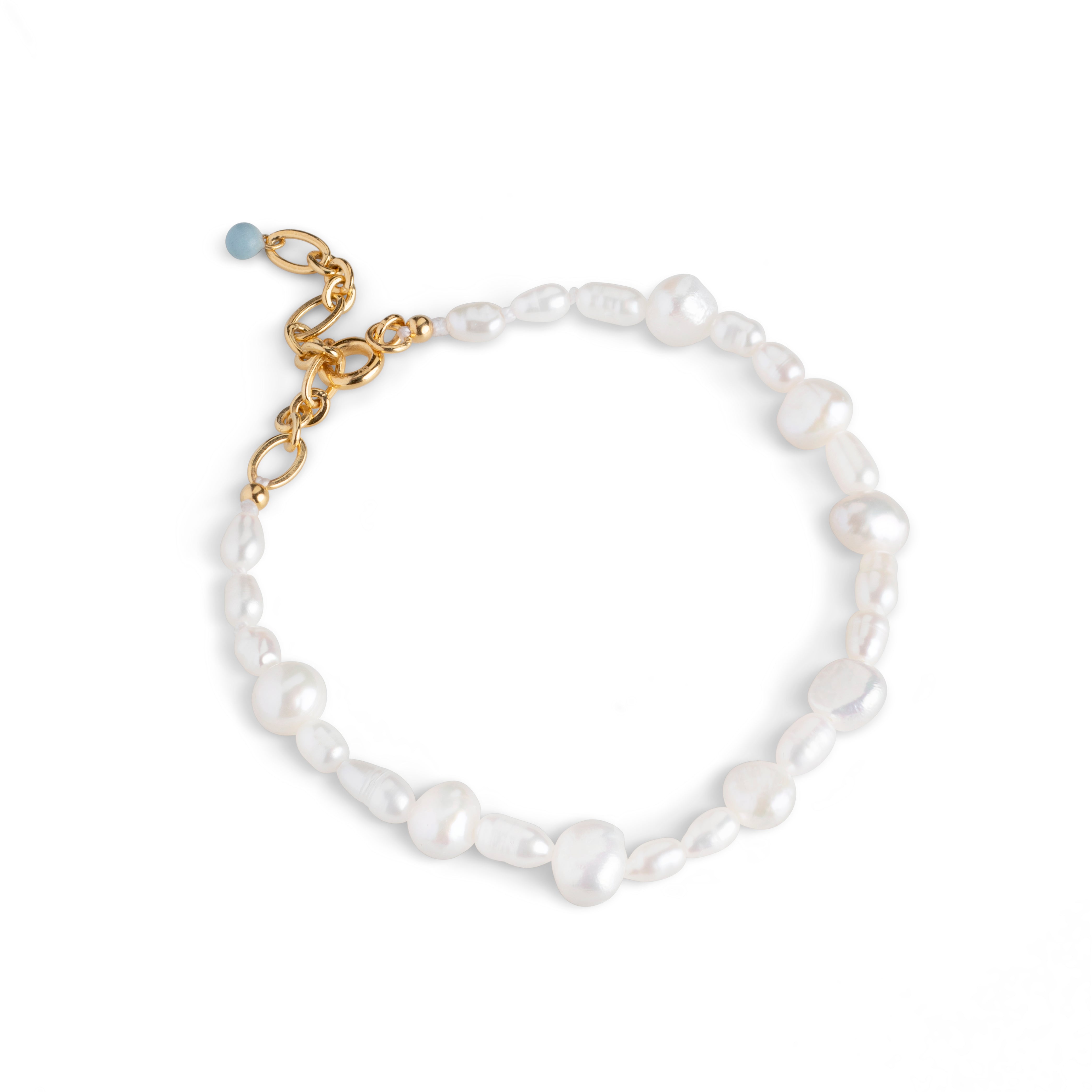 White pearl bracelet with gold clasp and light blue accent bead.