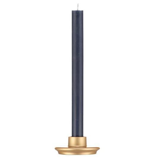 Dark blue taper candle in a gold-colored holder.