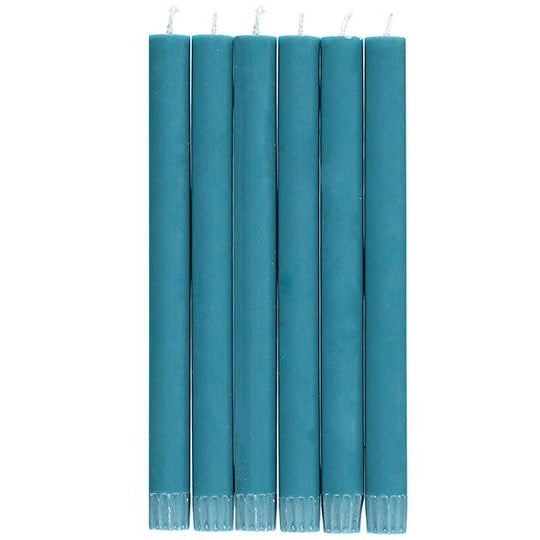 Six teal-colored taper candles arranged in a row.