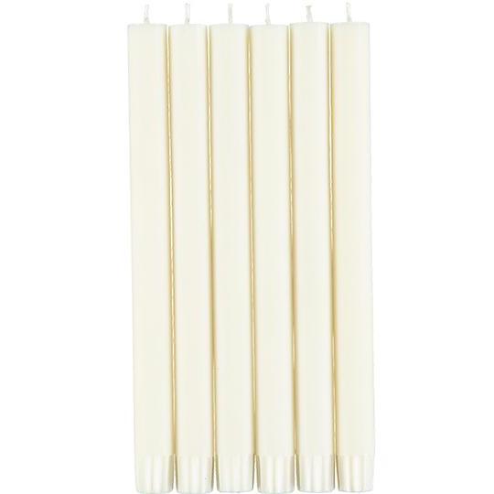 Seven off-white, slender taper candles arranged together.