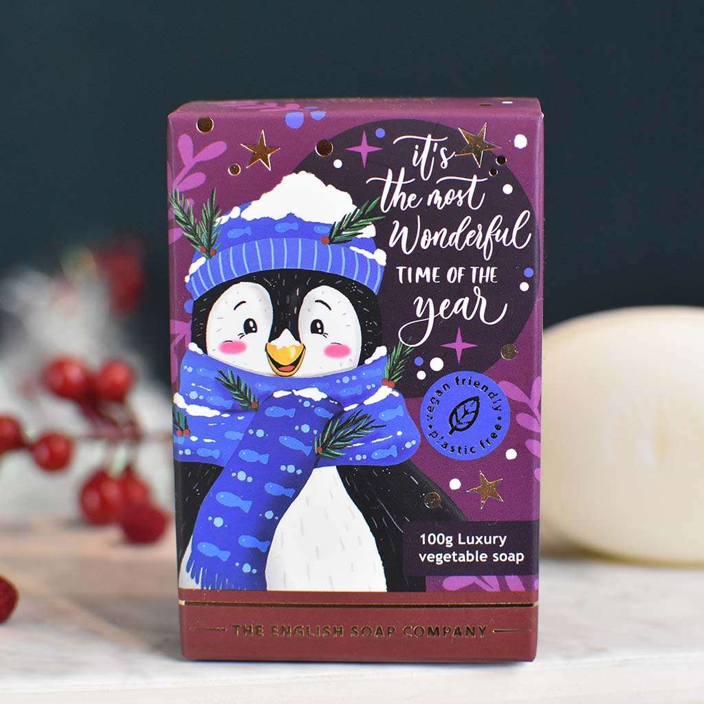 100g luxury vegetable soap bar featuring a cartoon penguin wearing a blue scarf; purple box with "It's the most wonderful