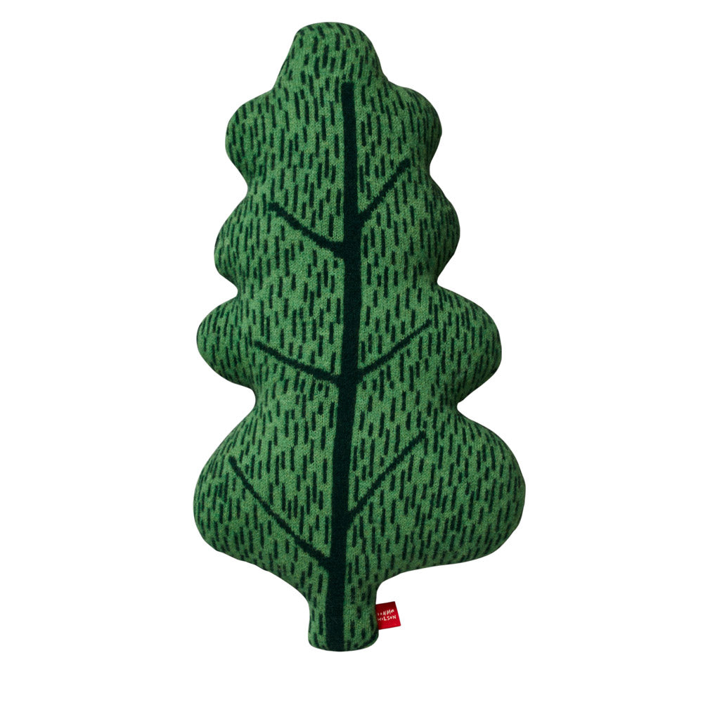 Green leaf-shaped cushion with a textured pattern, by Donna Wilson. Features various shades of green.