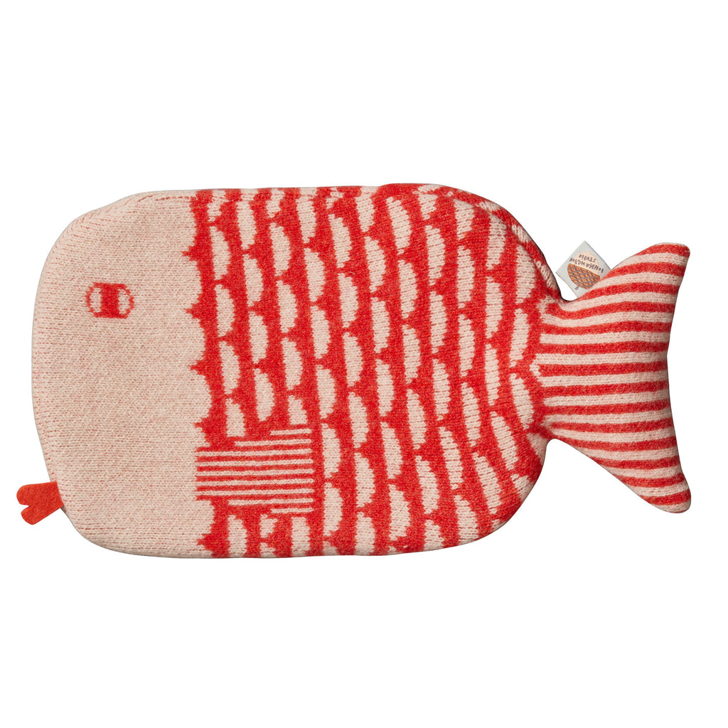 Red and cream fish-shaped hot water bottle by Donna Wilson, featuring a scaly pattern and striped tail.