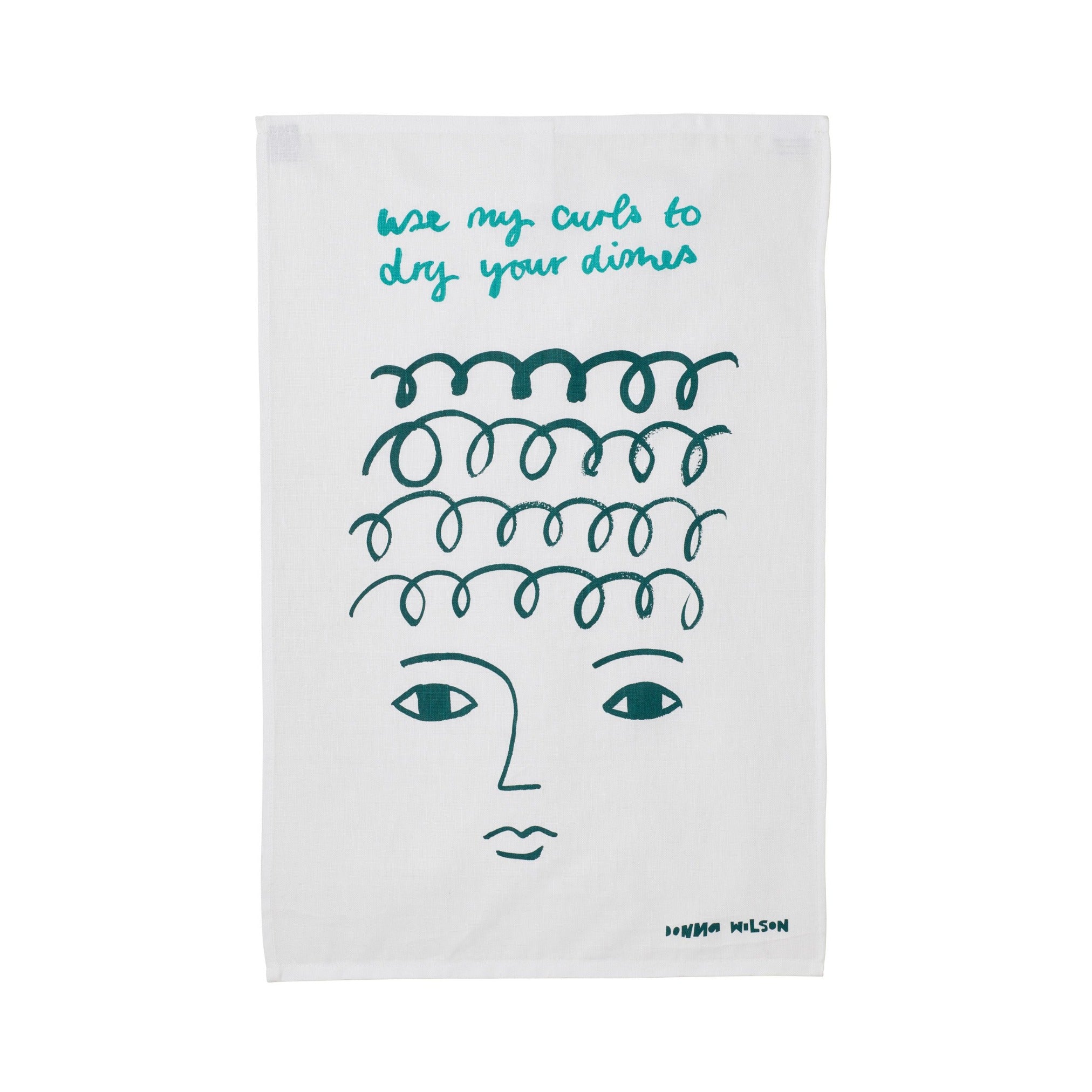 White tea towel by Donna Wilson featuring teal curls and face illustration with text "use my curls to dry your dishes."