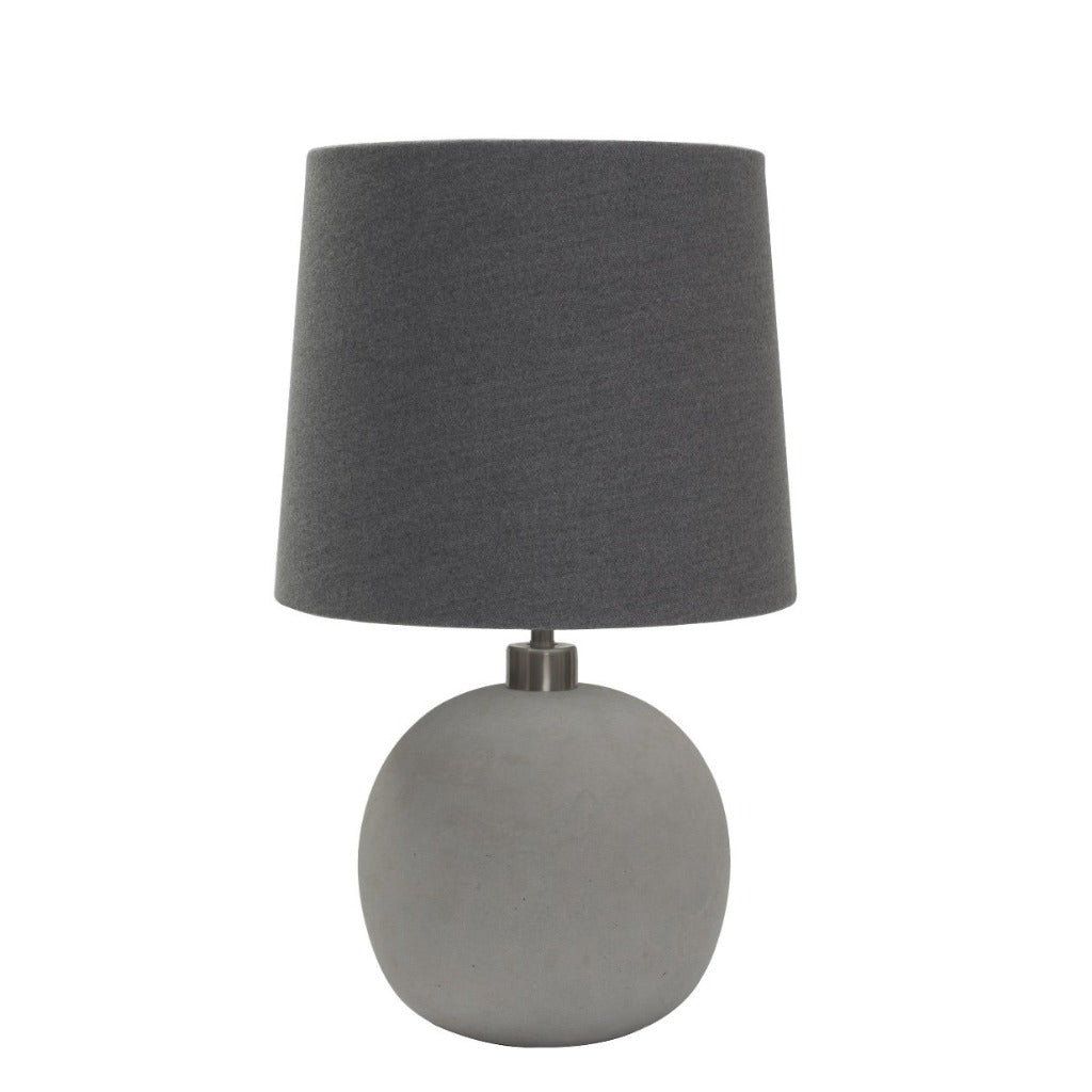 Grey concrete table lamp with a dark grey fabric shade.