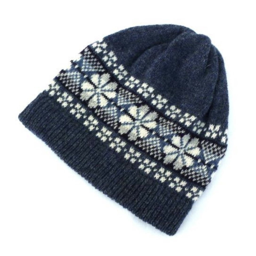 Dark blue wool knit beanie with a Fair Isle-style pattern in off-white and lighter blue.