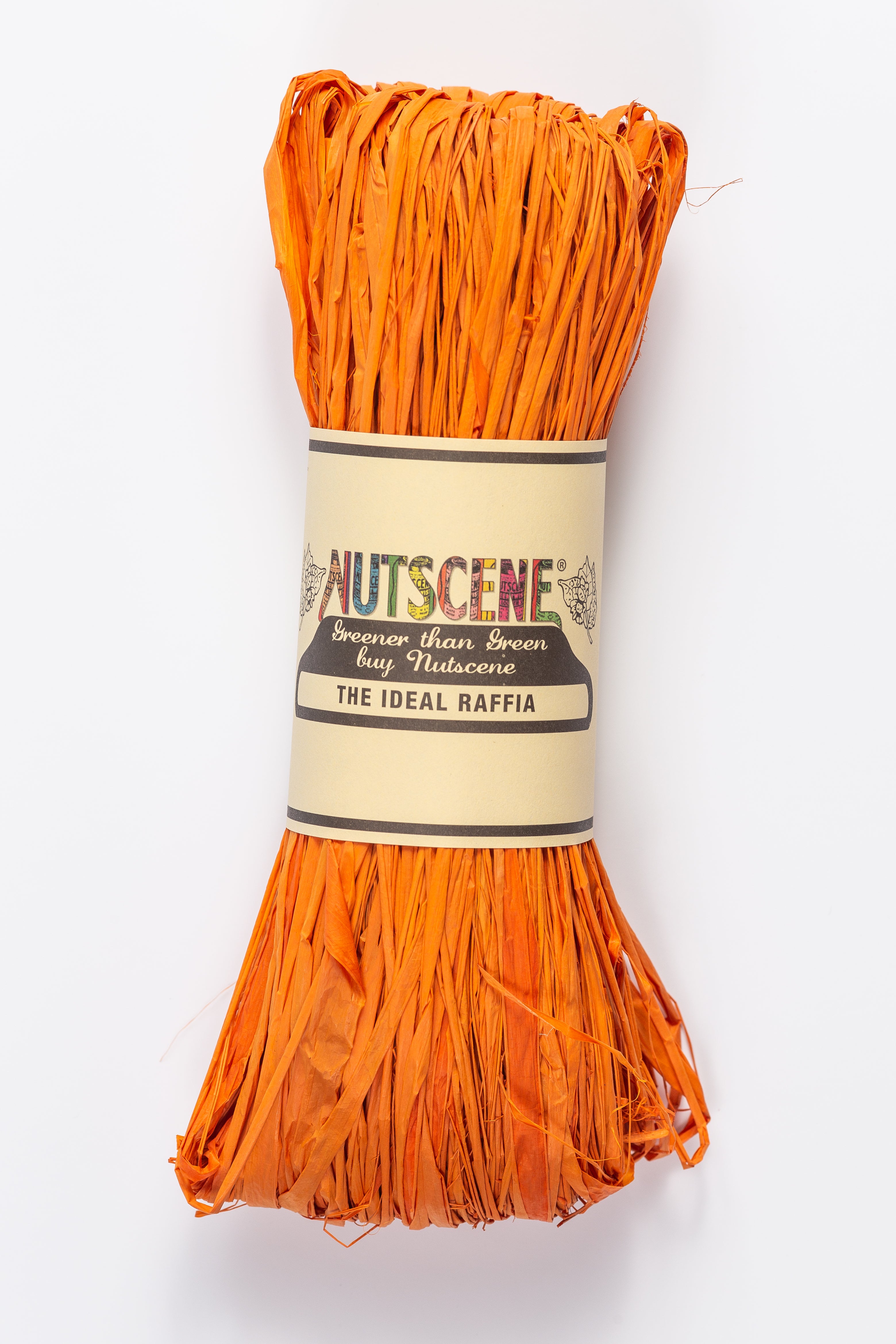 Bright orange raffia bundle, labeled "Nutscene The Ideal Raffia,"  wrapped in beige paper.