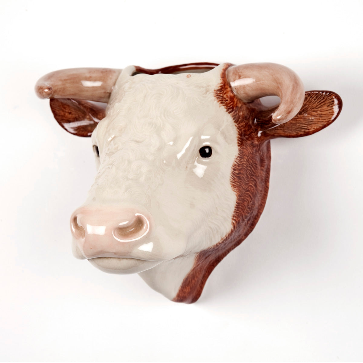 Ceramic bull head planter, off-white with brown markings, detailed features.