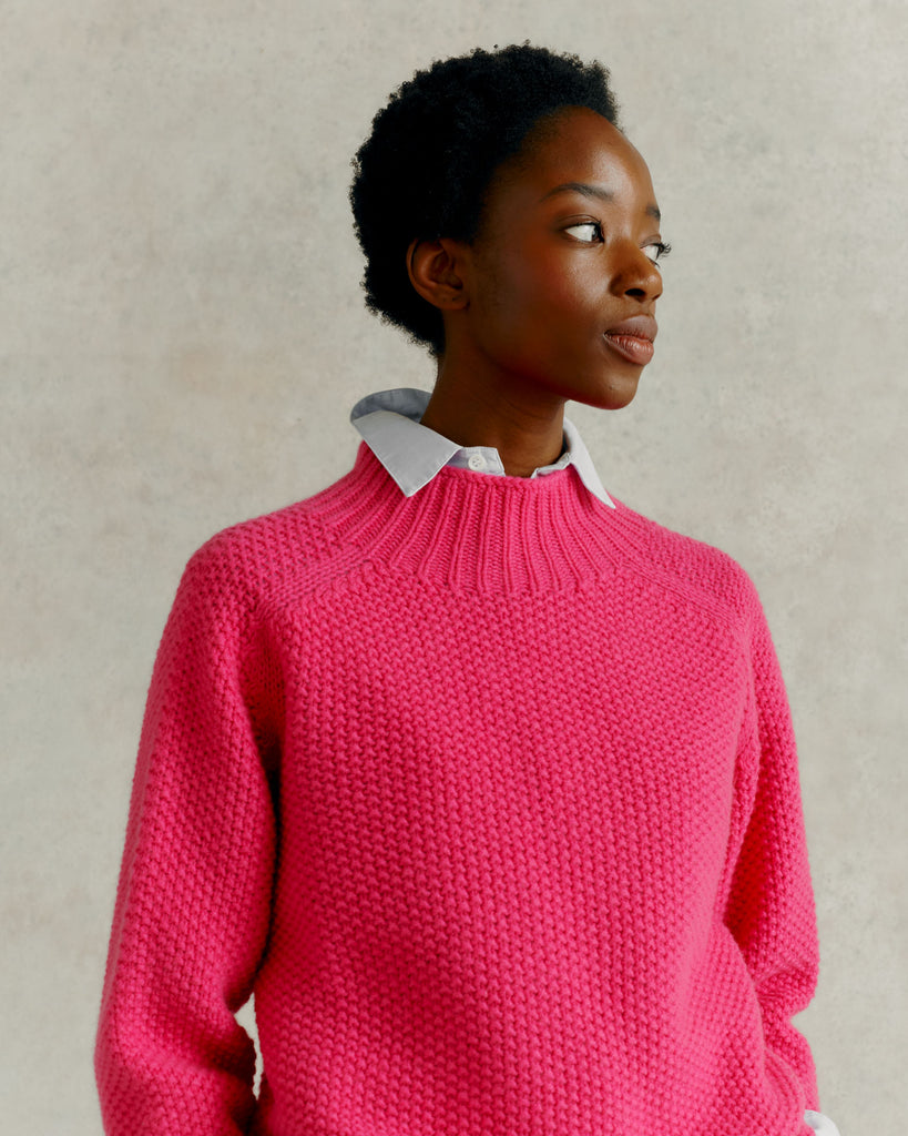 a female model looking to her left wearing a blue collared shirt and a Harley of Scotland Super Fine Moss Stitch Jumper - Punk