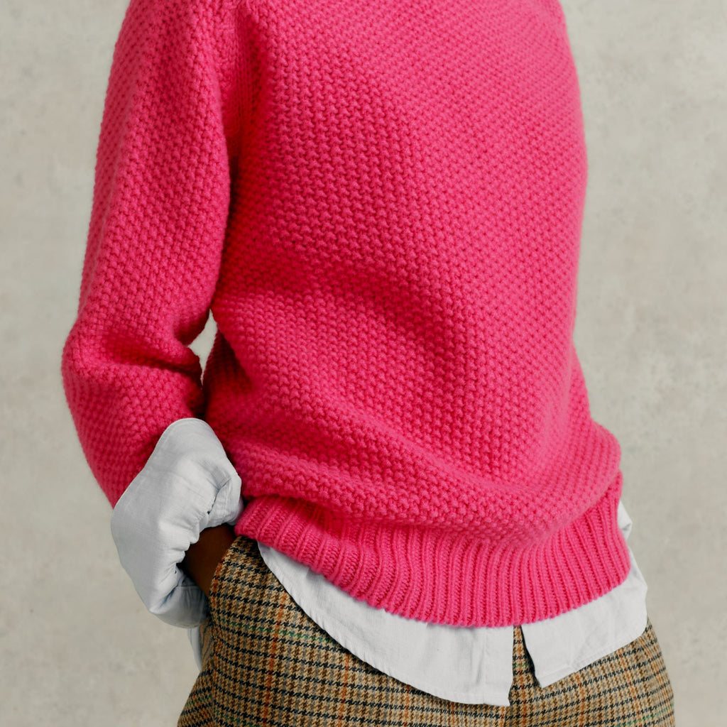 mid section close up of a female model wearing checked trousers and a Harley of Scotland Super Fine Moss Stitch Jumper - Punk