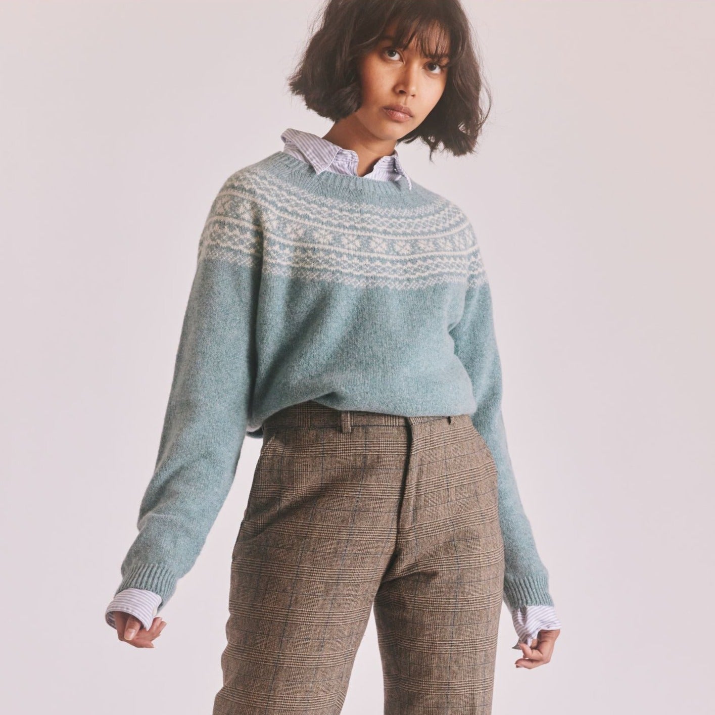 Dusty blue oversized knit sweater with a cream Fair Isle-style yoke.