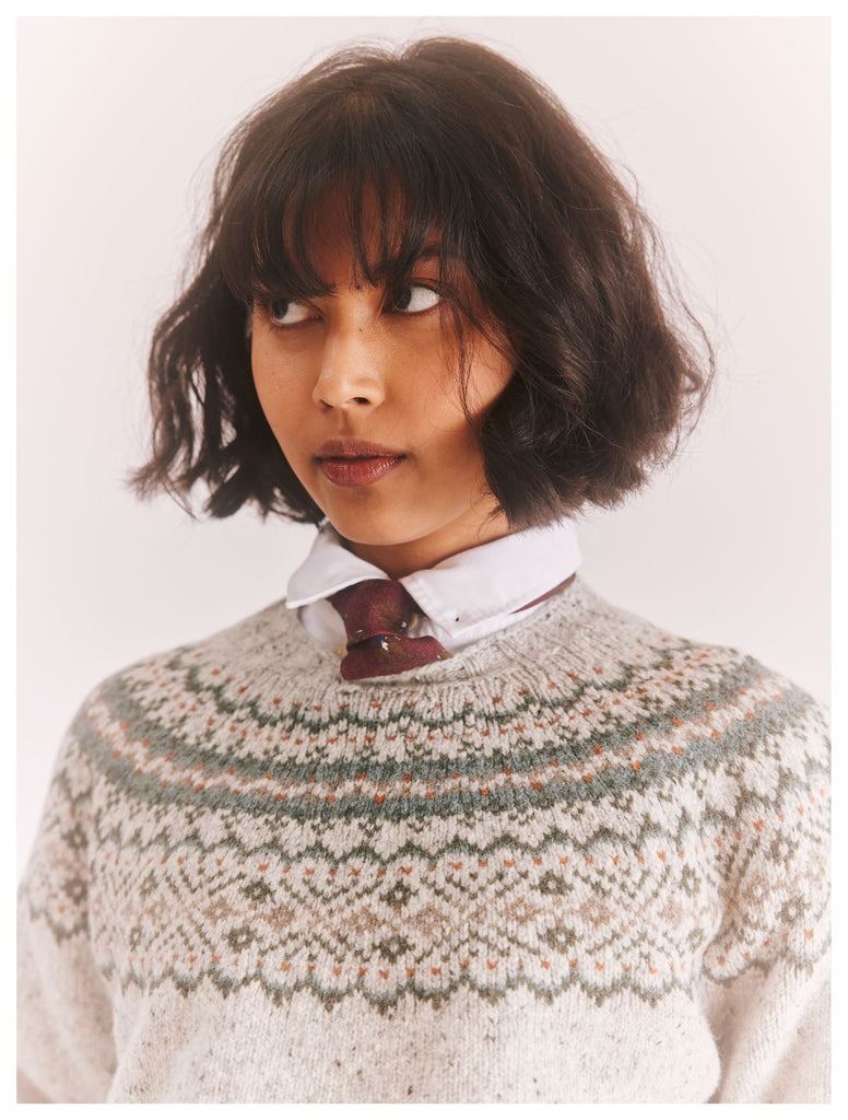 headshot of a female model, wearing a Harley of Scotland Fairisle Jumper - Islay