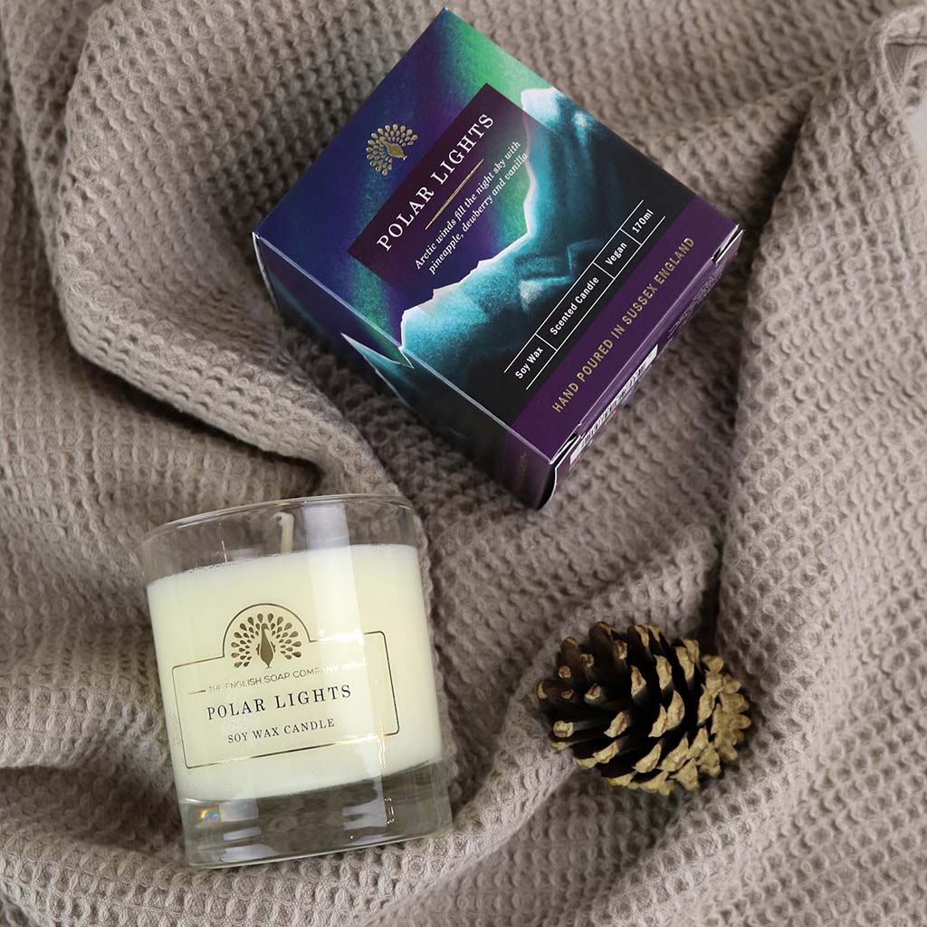 Soy wax candle in a clear glass jar, labeled "Polar Lights."  The candle is shown with its packaging box.