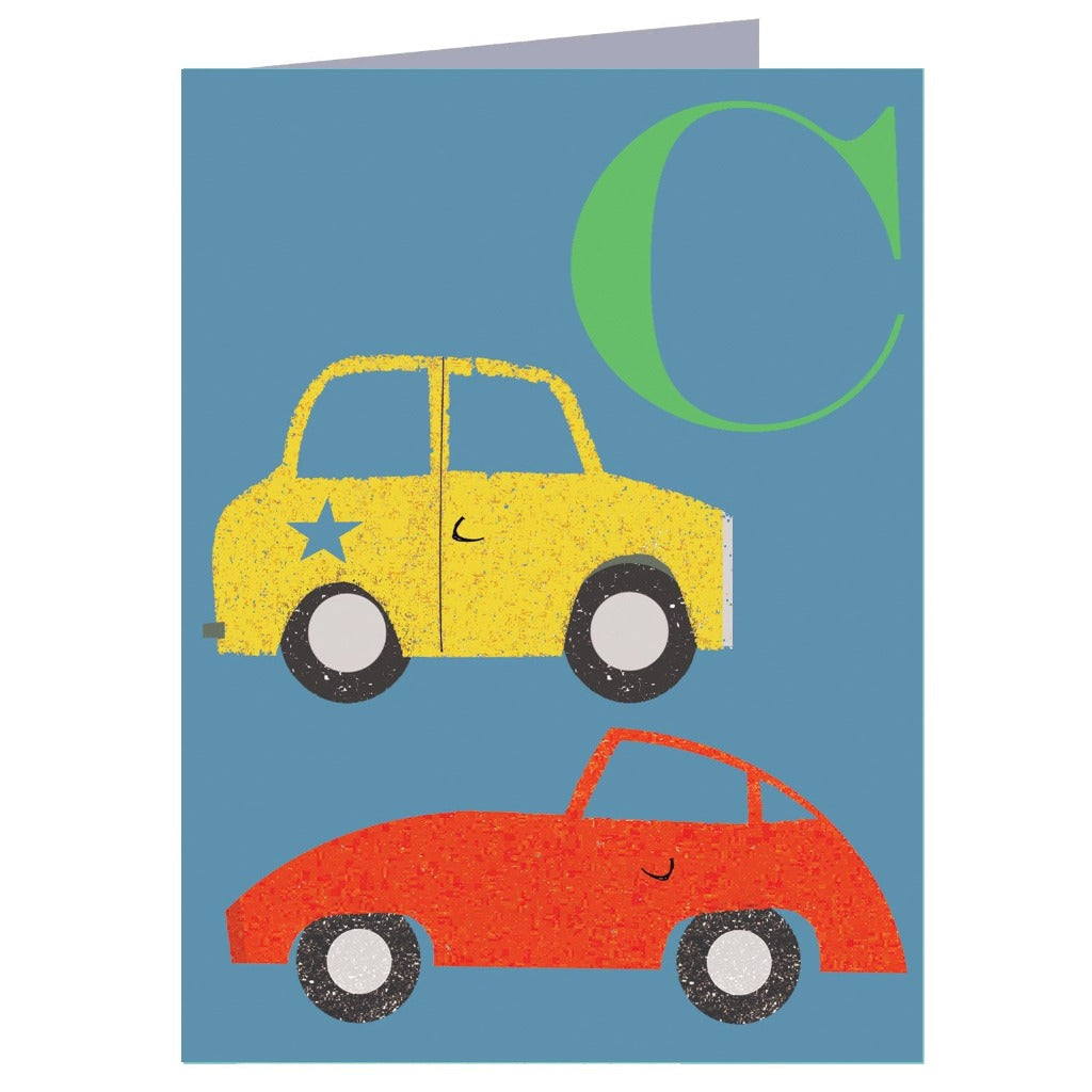 Greeting card featuring a yellow and red car illustration with a large green "C".