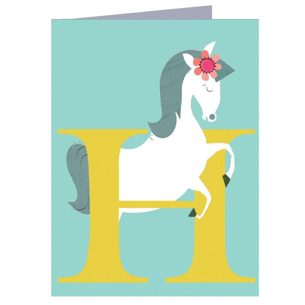 Illustration of a white horse with a flower in its mane positioned within a large yellow letter H on a teal background.