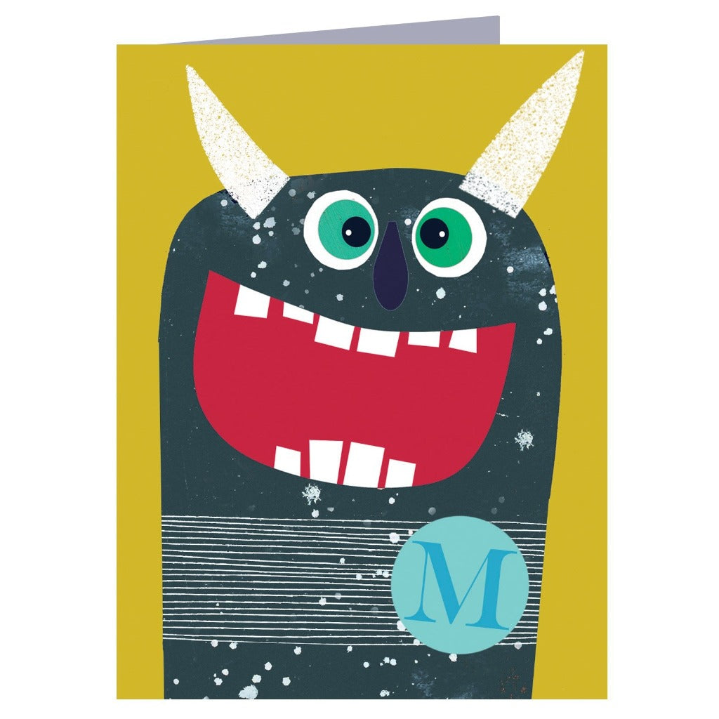 Greeting card featuring a friendly, cartoon monster with large green eyes, a wide red mouth, and white horns.