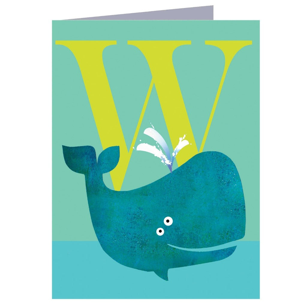 Greeting card featuring a teal whale behind a large yellow letter W, water spouting from its blowhole.