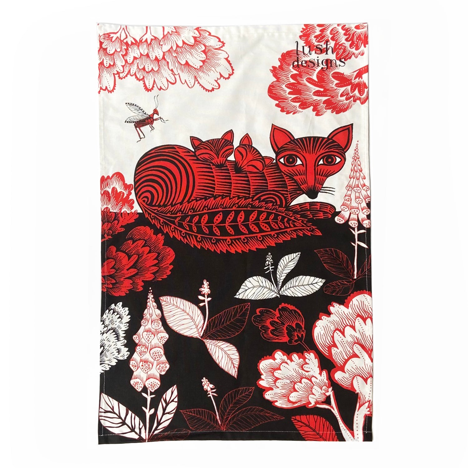 Red and black tea towel featuring a stylized fox family nestled amongst floral designs.