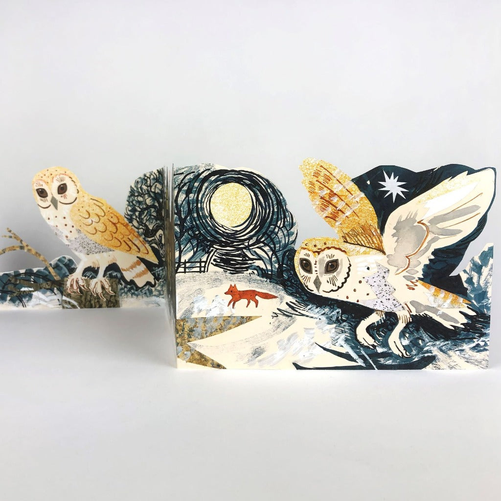 Pop-up card depicting two barn owls in a winter scene, one perched and one in flight, with a fox visible in the background