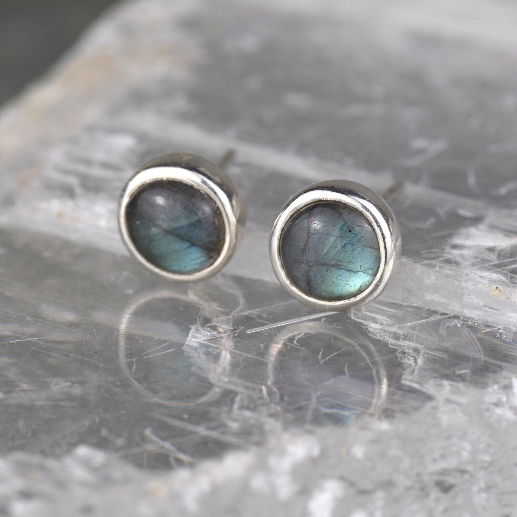 Pair of round labradorite stud earrings with silver settings.
