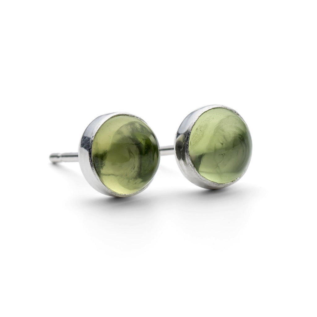 Pair of olive green gemstone stud earrings in silver settings.
