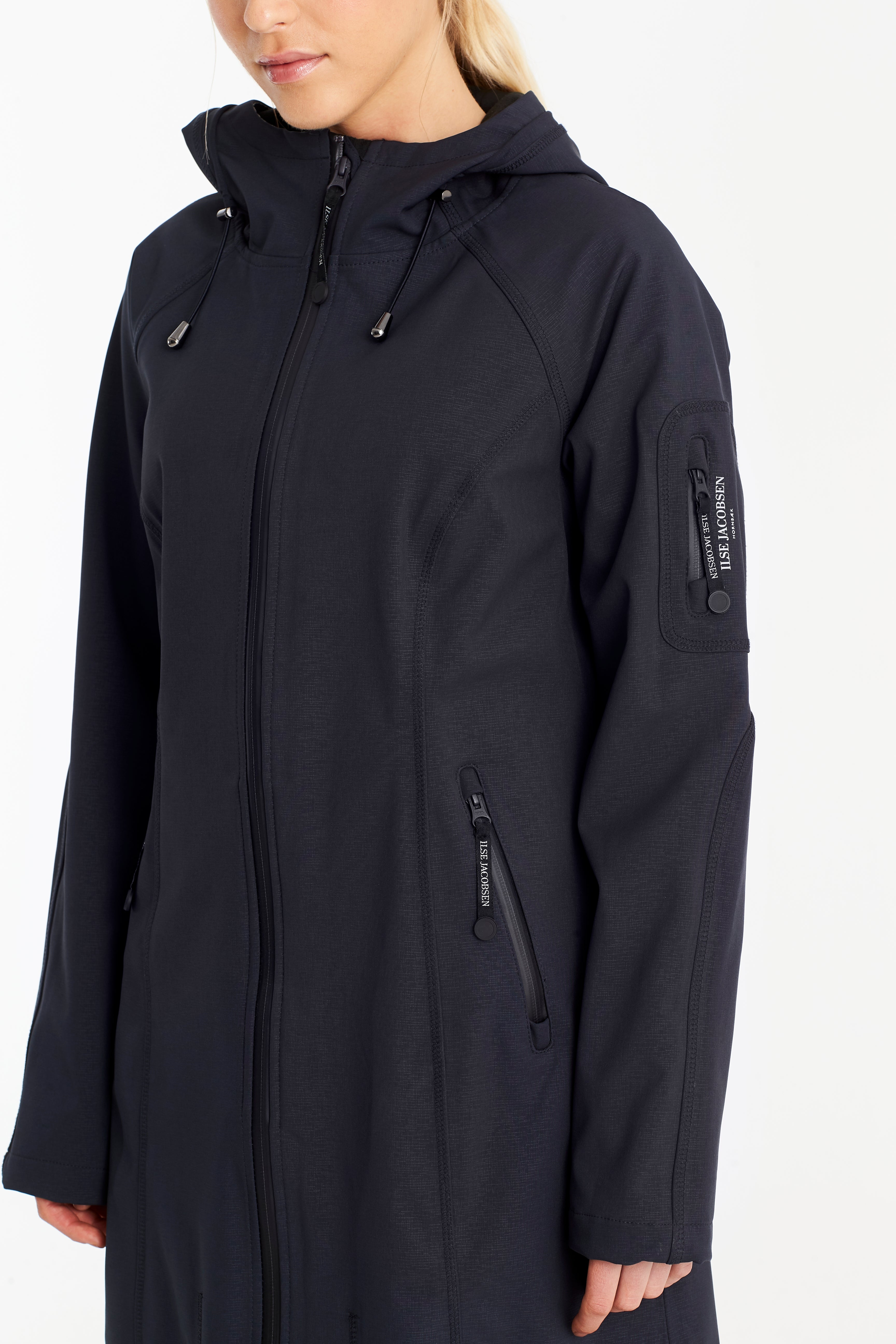Dark navy Ilse Jacobsen hooded softshell coat; textured fabric, zip front, and branded sleeve pocket.
