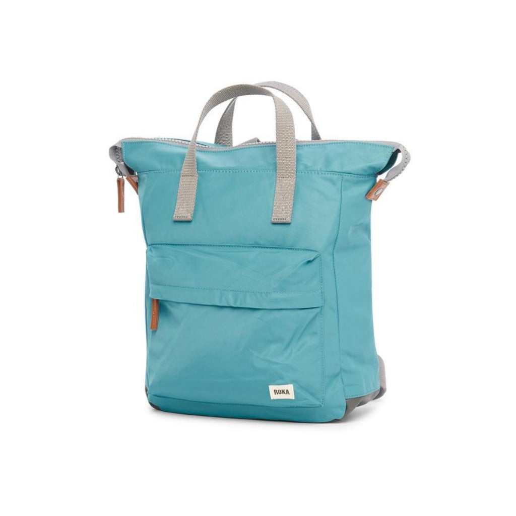 Teal Rokka backpack with gray handles and a small front pocket.