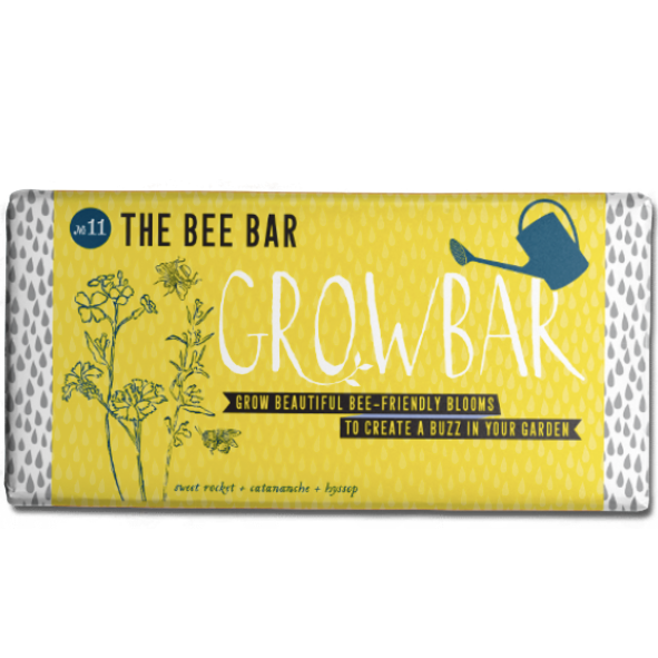 Growbar seed packet: yellow packaging with illustrations of bee-friendly flowers, bees, and a watering can.