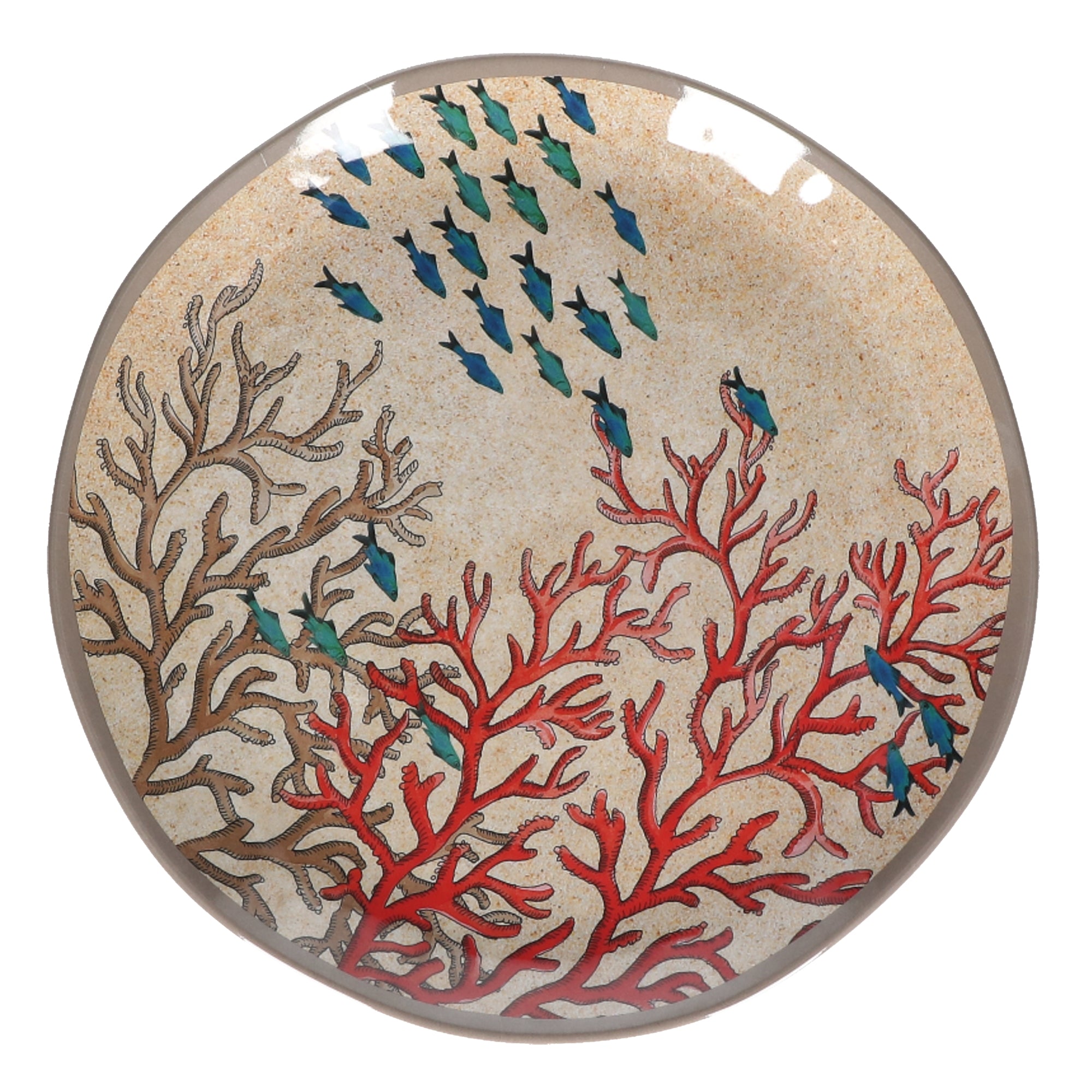 Round platter with beige background featuring red and brown coral and small blue fish.