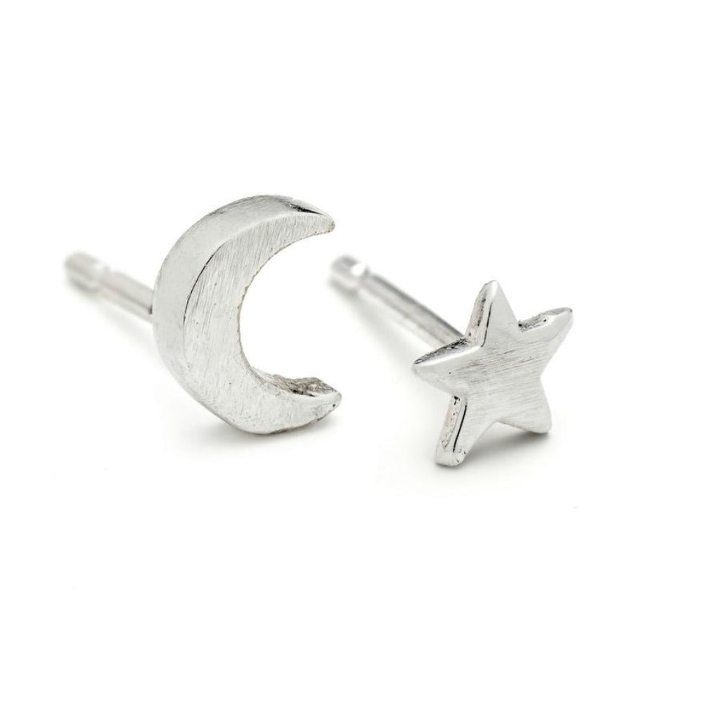 Silver crescent moon and star stud earrings.  Textured metal finish.