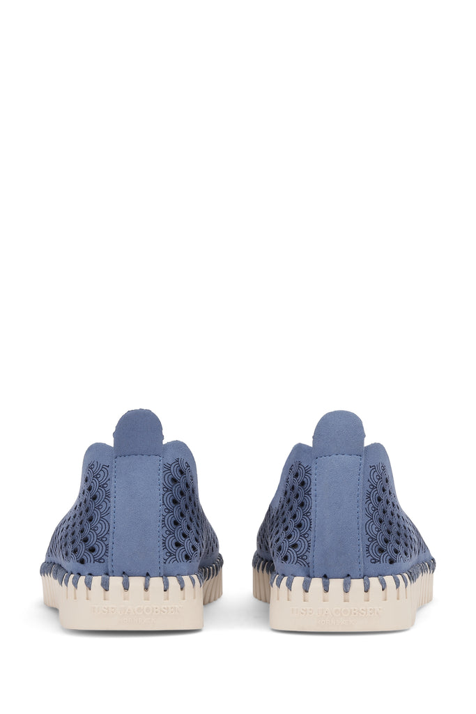 Pair of Ilse Jacobsen Hornbæk blue suede slip-on shoes with laser-cut pattern and cream sole.
